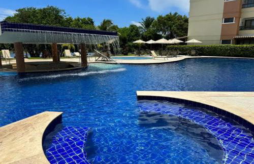 GUARAJUBA PARAÍSO DAS ÁGUAS - APT 2 quartos com AR e TV em TODOS os cômodos - Incluso Roupa de CAMA e BANHO - Filtro de Água Gelada e Maquina de Lavar dentro do APT - TOTAL CONFORTO PARA VC E SUA FAMILIA - Cond A beira da Lagoa e perto da PRAIA - Foto 3