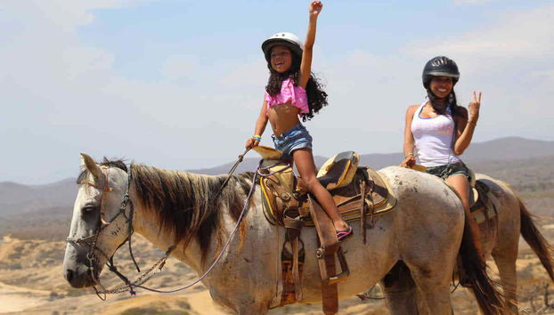 Enjoying their first horse ride