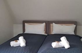 Modernes Ferienhaus mit 4 separaten Appartements, je mit vollausgestatteter Küchenzeile und eigenem Bad, 2 Gehminuten zum Badesee, Garten, Grillplatz, Kinderspielbereich, Hunde sind willkommen - Foto 9