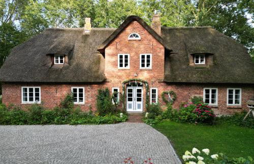 Dachgeschosswohnung Warft Simmerdeis in Reetdachhaus mit parkähnlichem Garten - Foto 30