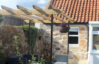 Carpenters Cottage- coastal stay with garden - Foto 23