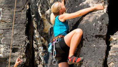 Climbing with all the safety equipment in place