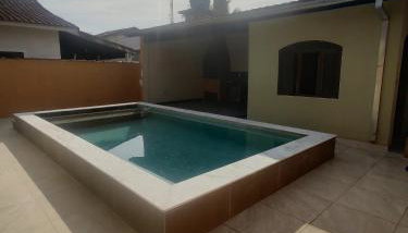 Casa piscina com ozônio churrasqueira perto da praia - Foto 3