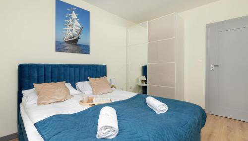 Apartment Starowiejska with Balcony & Parking next to Gdańsk Arena Stadium by Noclegi Renters - Foto 2, wardrobe