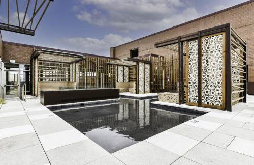 Comfy 2BR Oasis with Scenic Rooftop & Gym - Photo 10