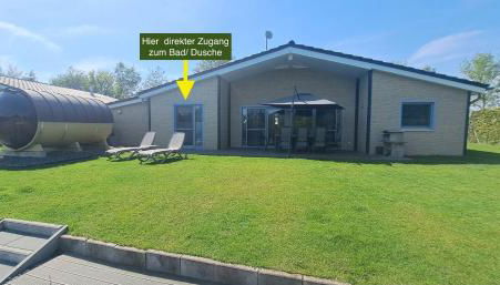 Ferienhaus Deluxe, direkt am See, mit hauseigener Panorama Außensauna, zwei Badezimmern, Tretboot, Kamin, in direkter nähe zum Kinderspieleparadies sowie Reit- und Ponyhof, 1 bis 8 Personen - Foto 5, Garden