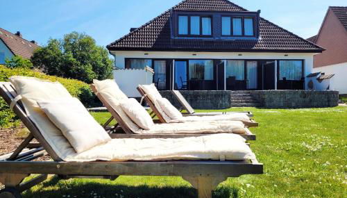 Hochwertige Ferienwohnung in ruhiger Lage mit eigener Terrasse und Parkplatz, nur 7 Gehminuten zum Strand entfernt - hoher Schlafkomfort dank Boxspringbett - Foto 5, Garden