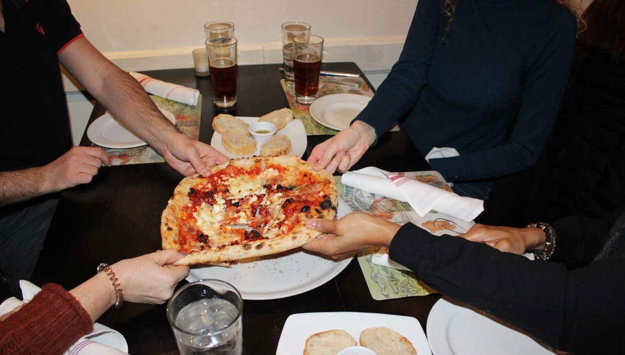 Enjoying a Neapolitan pizza