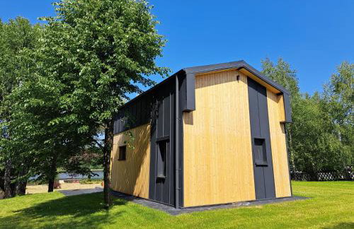 Domki przy jeziorze z prywatną plażą w Borach Tucholskich Pensjonat Alicja wczasy z dziećmi nowe luksusowe domki na skraju jeziora i lasu - Foto 51