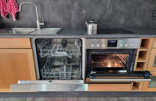 Gemütliche Ferienwohnung mit 1 Schlafzimmer, Wohnzimmer mit Schlafcouch & voll ausgestattete Küche - Foto 23