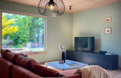 Amber Ferienhain - Ferienhaus 'Magnolie' mit verwunschenem Garten & privater Sauna - Foto 13