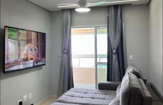 APTO BEIRA MAR - ACONCHEGANTE _ VARANDA GOURMET - WIFI - NETFLIX - TV A CABO - PRAIA GRANDE - Photo 2