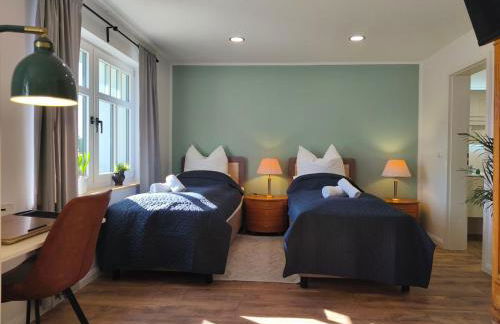 Modernes Ferienhaus mit 4 separaten Appartements, je mit vollausgestatteter Küchenzeile und eigenem Bad, 2 Gehminuten zum Badesee, Garten, Grillplatz, Kinderspielbereich, Hunde sind willkommen - Foto 6