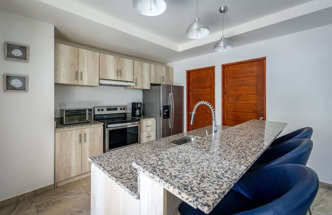 Ultramodern Townhome with an Inviting Coastal Design and Lush Outdoor Oasis with a Private Pool - Photo 11