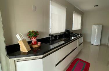 Apartamento em Poços - Varanda com Churrasqueira - Foto 11