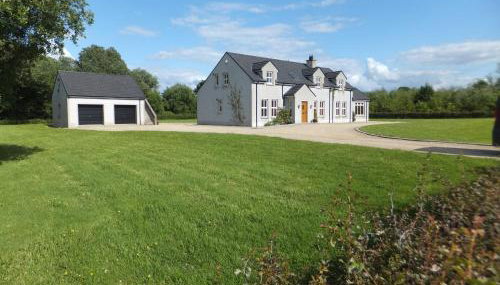 The Gatehouse at Mullans Bay - Foto 1, Garden