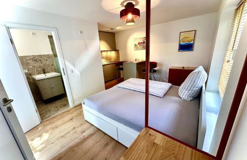 Stylisches See-Studio mit Badezugang & Garten - Photo 18