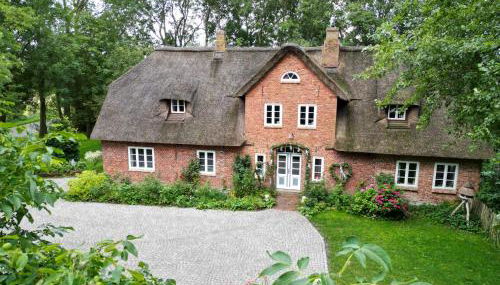 Dachgeschosswohnung Warft Simmerdeis in Reetdachhaus mit parkähnlichem Garten - Foto 3