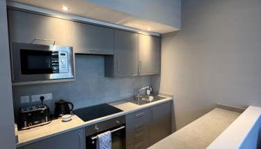 The Globe Apartments and Bedrooms - Foto 4, stove