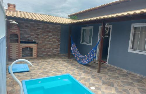 Casa com piscina a 500m da praia em Unamar - Foto 1