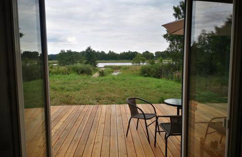 Dom nad jeziorem z prywatnym pomostem i linią brzegową - Foto 19