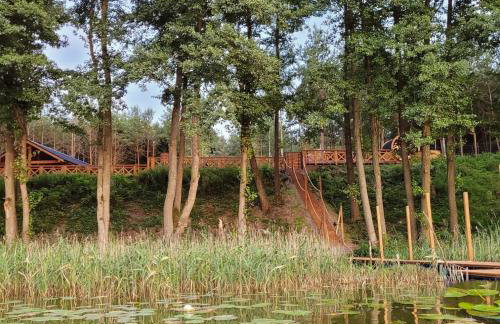 Leśna Kryjówka domki w lesie - Foto 45