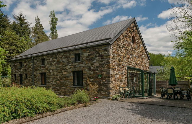 Rustic Holiday Home with Sauna & Hot Tub in Wooded Area - Photo 1