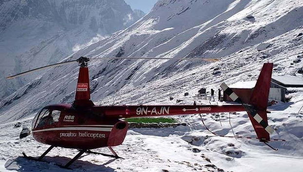 A helicopter in the snowy Himalayas