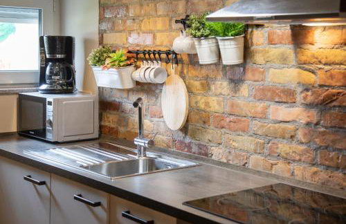 Stylish Urban Oasis - Design 2BR Apartment with Parking - Photo 13