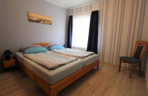 Böltser Hus Ferienwohnungen mit Strandkorb und Kamin 10 Gehminuten zum kurtaxefreien Sandstrand - Foto 33