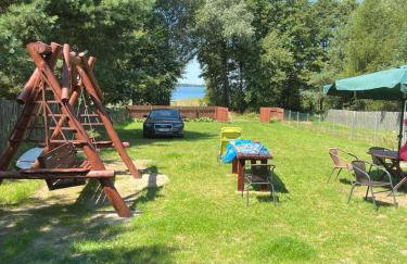 Słońce i Woda - 2 domki nad brzegiem jeziora Śniardwy z własnym pomostem, zejściem do wody i przecudnym widokiem na jezioro - Foto 1