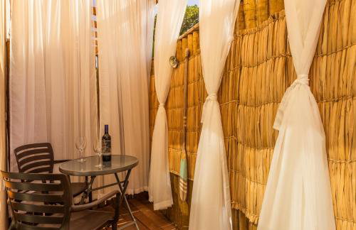 Casa d'Aroeira Residencial Boutique - Centro de Juqueí - Perto de Tudo - 2 quadras do Mar - Serviço de Praia - Roupa de Cama 600 fios algodão Egípcio - Tudo Novo - Estacionamento Interno - Cozinha - Consulte unidades com Ofurô Hidro e Cromoterapia - Foto 38