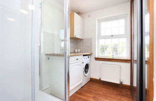 JOIVY Greenknowes Farmhouse with Hot Tub and Bar - Photo 30