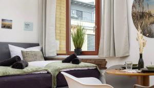 mayhome - das STRANDLOFT schönes Studioapartment mit Balkon, Küche und Tiefgarage - Sauna und Fitness direkt nebenan - Foto 3