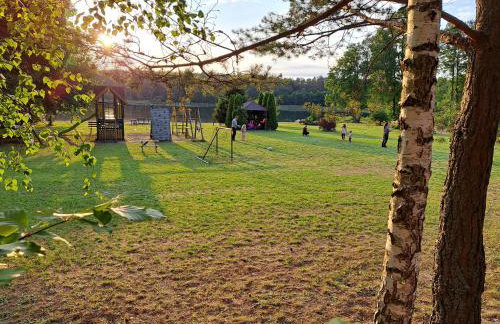 Domki przy jeziorze z prywatną plażą w Borach Tucholskich Pensjonat Alicja wczasy z dziećmi nowe luksusowe domki na skraju jeziora i lasu - Foto 20