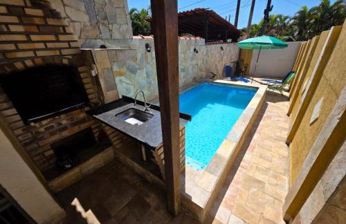 Casa com Piscina Aquecida, Churrasqueira e Wi-fi, lado praia de Itanhaém - Foto 1