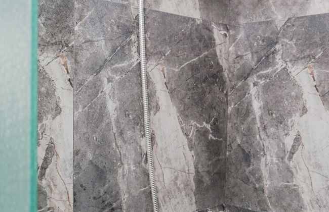 Minimalist and Cozy Studio Apartment at Tuscany Residences - Photo 13