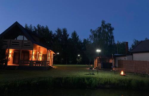 Domek drewniany nad stawem - Foto 14