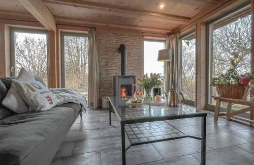 traumHaff Küstenchalets - einzigartige Chalets an der Ostsee. Ganz aus Lärchenholz mit Kamin und Sauna - Foto 7