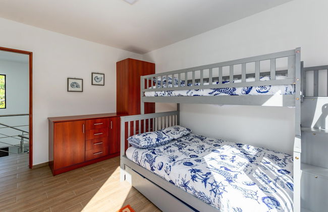 Ultramodern Townhome with an Inviting Coastal Design and Lush Outdoor Oasis with a Private Pool - Photo 7