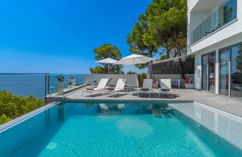 Can Ema, villa moderna con piscina frente al mar - Photo 43