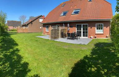 Nessmersiel, Renovierte Erdgeschosswohnung mit Garten, in Deichnähe, Wallbox, - Foto 13