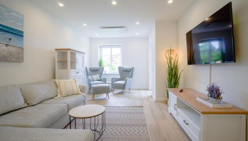 Sonnenterrasse - Helle & moderne Ferienwohnung am Meer - Foto 2