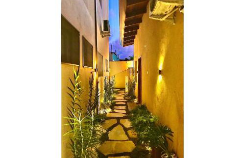 Casa d'Aroeira Residencial Boutique - Centro de Juqueí - Perto de Tudo - 2 quadras do Mar - Serviço de Praia - Roupa de Cama 600 fios algodão Egípcio - Tudo Novo - Estacionamento Interno - Cozinha - Consulte unidades com Ofurô Hidro e Cromoterapia - Foto 74