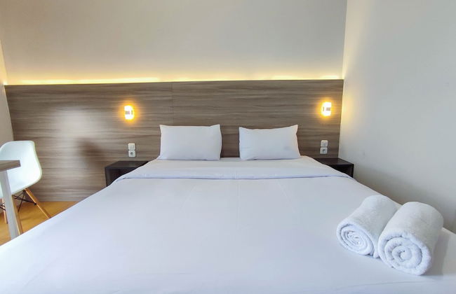 Comfort 1Br At Amartha View Apartment - Photo 1