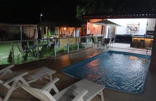 Linda casa com piscina, quiosque e churrasqueira a 150 metros da praia - Foto 1