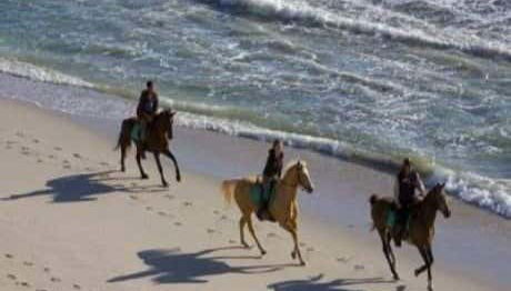 Riding along Bonfil beach