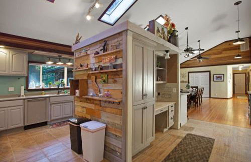 Tree-lined Home with Hot Tub Firepit & Large Yard - Photo 6