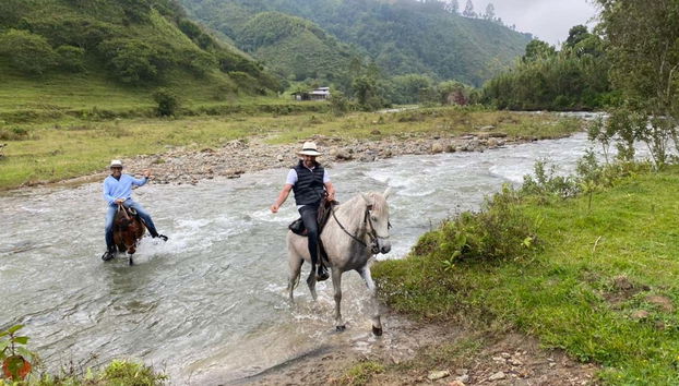Crossing the river on horseback