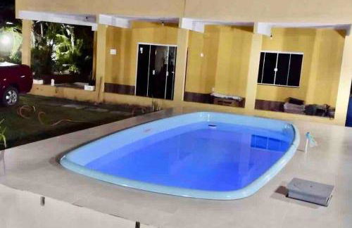 Casa com churrasqueira e piscina, perto de riacho - Foto 2